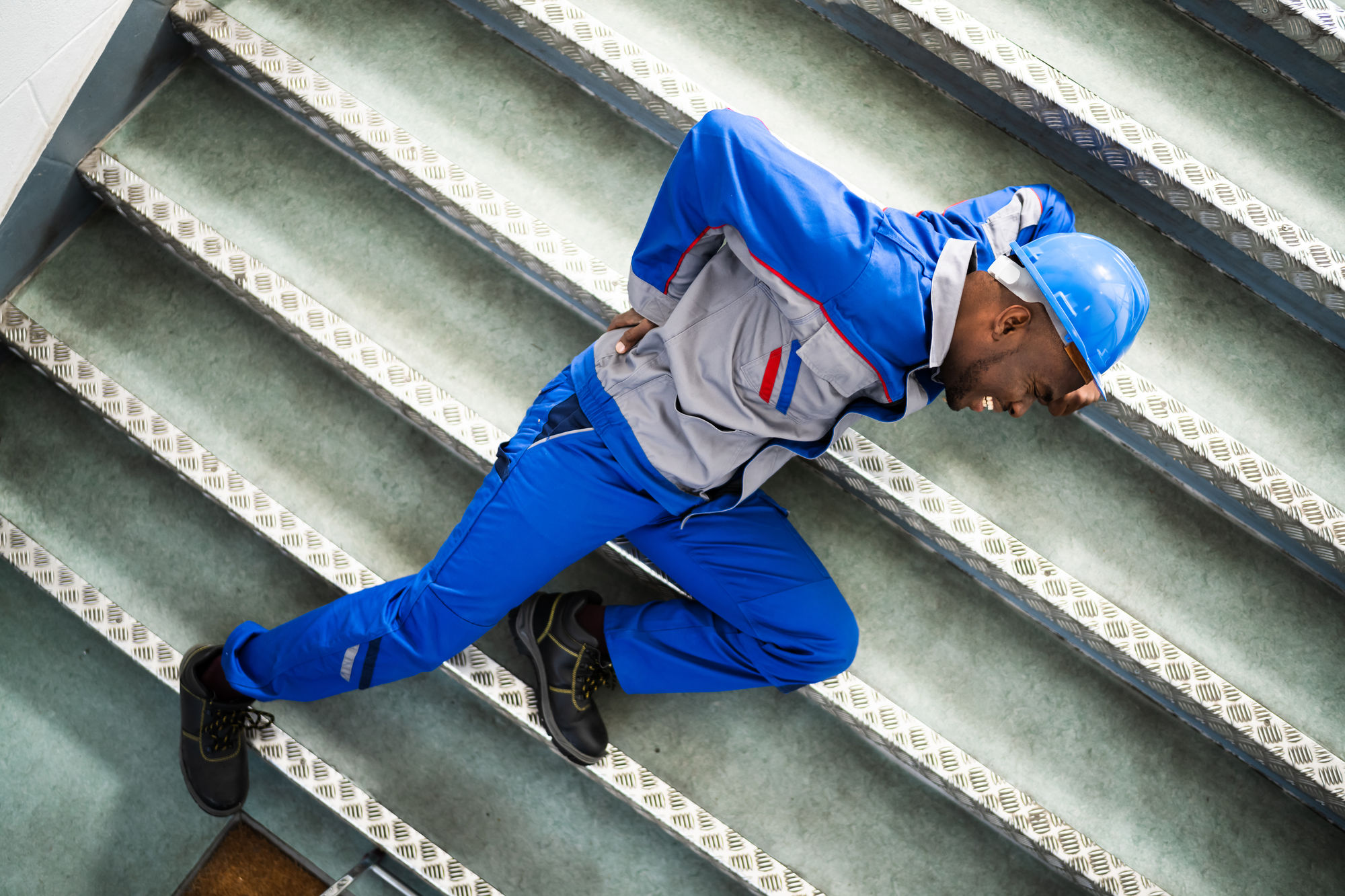 Factory Worker Slips on a Staircase